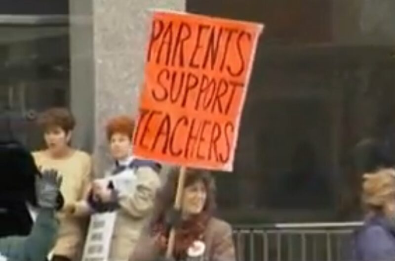 A demonstrator holding a 'Parents Support Teachers' sign during the 1997 Ontario teachers' strike